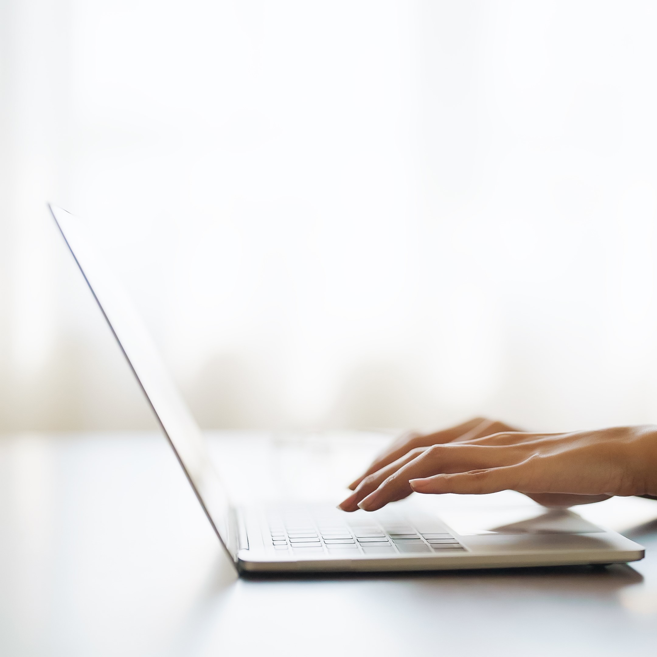 A woman searching on her laptop for "Free Parenting Classes in Arlington, Texas"