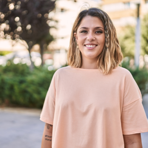 A woman smiling because she knows Metroplex Women’s Clinic offers free pregnancy services and support in Arlington, Texas